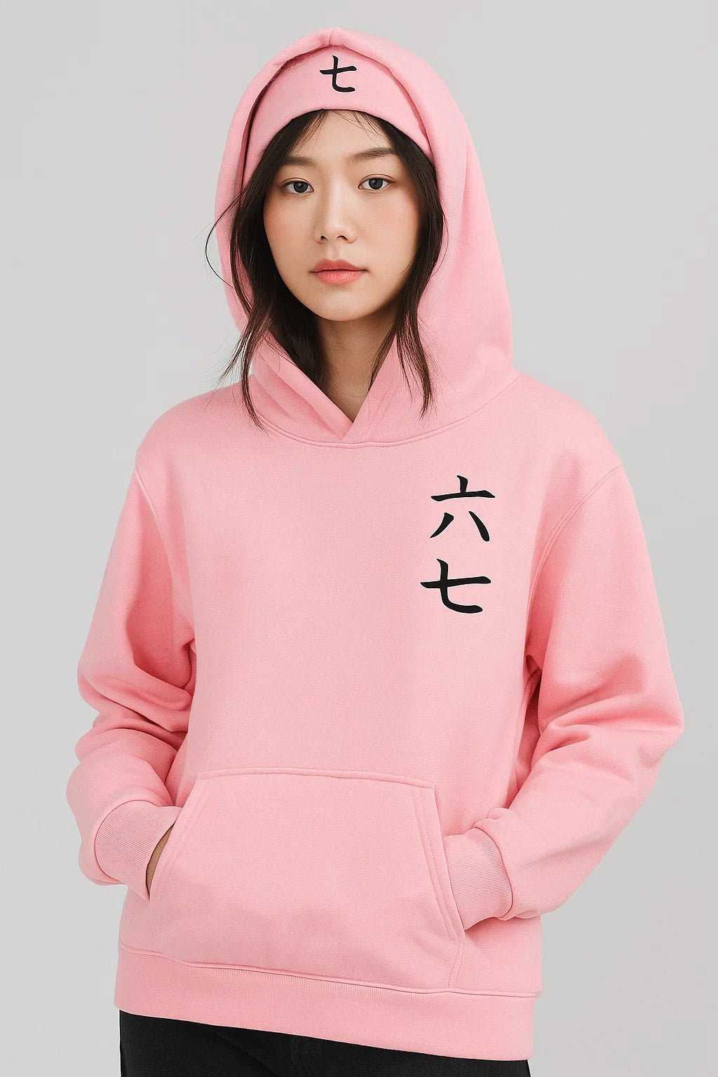 Pink anime assassin hooded sweatshirt showing hood calligraphy and chest lettering