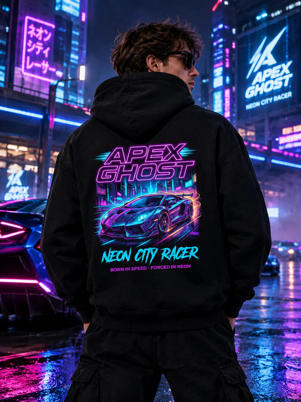 Man wearing hoodie showing back graphic with neon supercar in rainy neon-lit city street